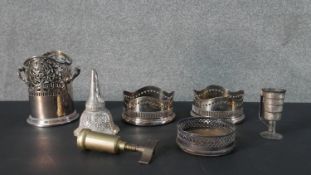 A collection of silver plate and brass wine related items, including a 19th century brass cork
