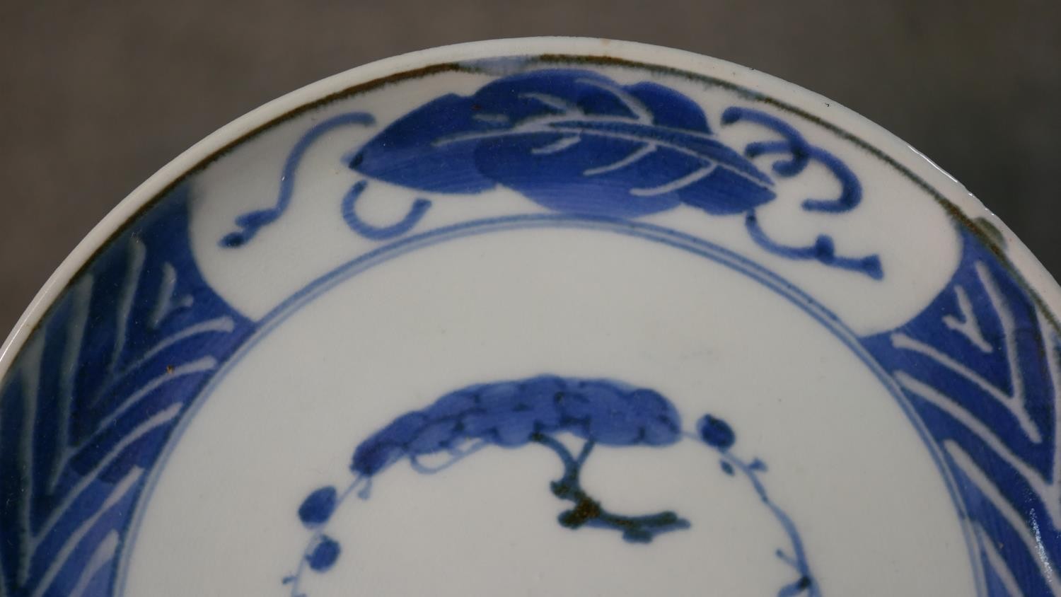 A pair of Japanese Edo period hand painted blue and white porcelain plates with tree and foliate - Image 3 of 11