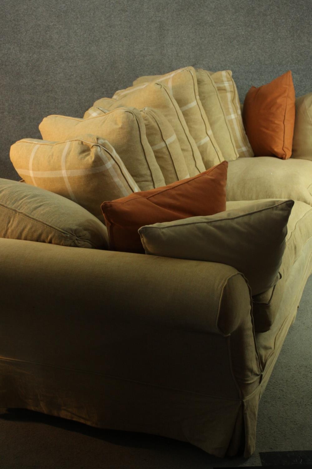 A contemporary three seater sofa, upholstered in ochre fabric, with scrolling arms and a selection - Image 7 of 8