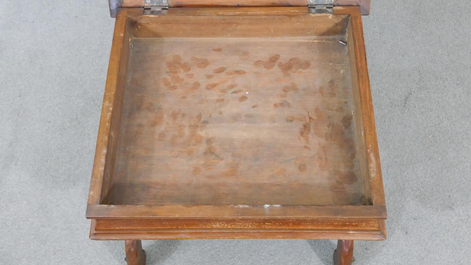 A Victorian walnut piano stool, the rising lid upholstered in machine made tapestry, on curved X - Image 3 of 6