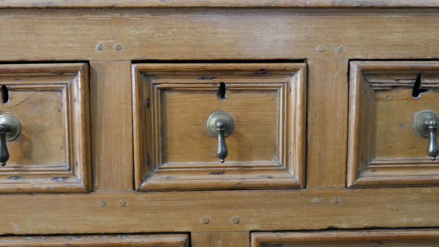 An 18th century pine chest, with a plank top above three short, over two short, over one long - Image 7 of 8