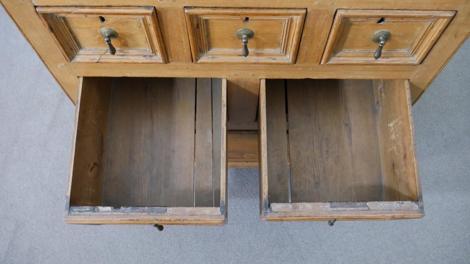 An 18th century pine chest, with a plank top above three short, over two short, over one long - Image 5 of 8