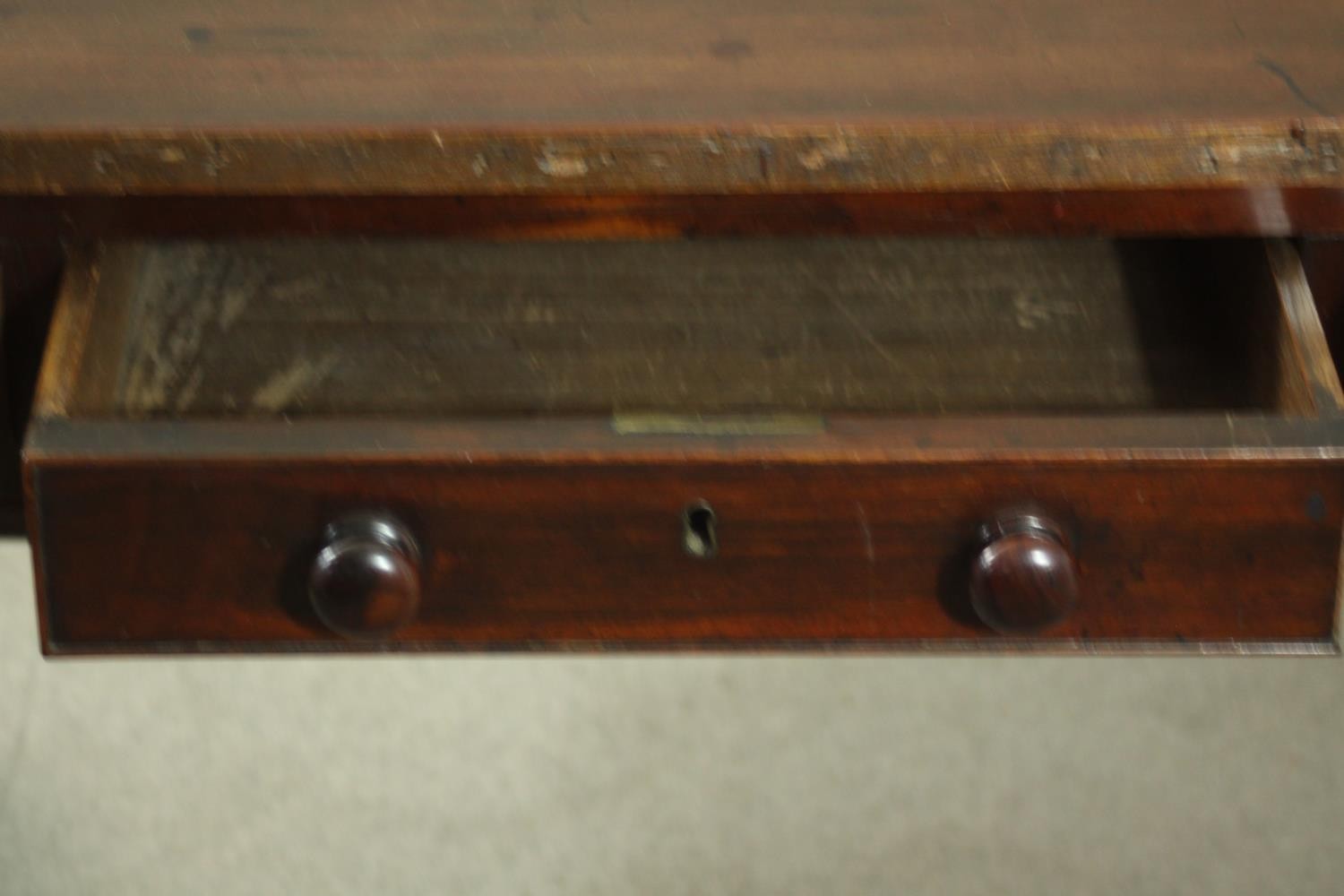A Victorian mahogany library table, with three short drawers, over end supports joined by a turned - Image 7 of 9