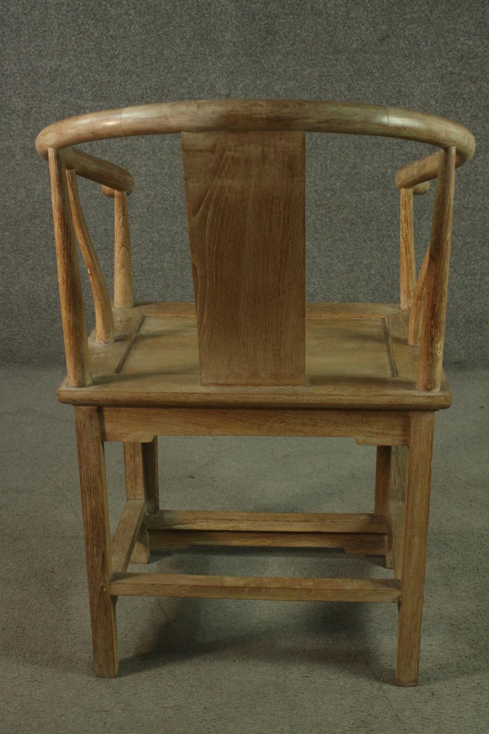 A pair of Chinese teak horseshoe back armchairs, with a plain splat back, the legs joined by - Image 14 of 17