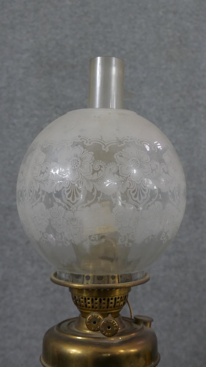 A Victorian brass converted oil lamp, with a globular etched glass shade. H.52 W.15cm - Image 4 of 6