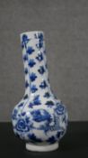 A Chinese blue and white porcelain vase, with a cylindrical neck and a globular body, painted with