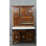 An early 20th century oak larder or pantry unit, with an arrangement of cupboard doors and