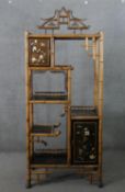 A Victorian Aesthetic movement bamboo shelving unit, in the Japanese taste, with Japan lacquered