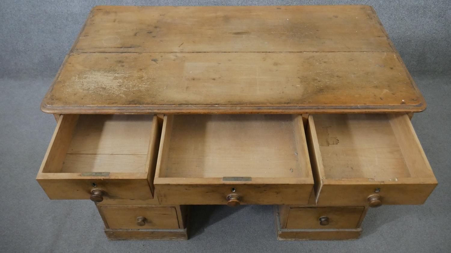 A Victorian pine kneehole desk, the rectangular top with a moulded edge, over an arrangement of nine - Image 4 of 6