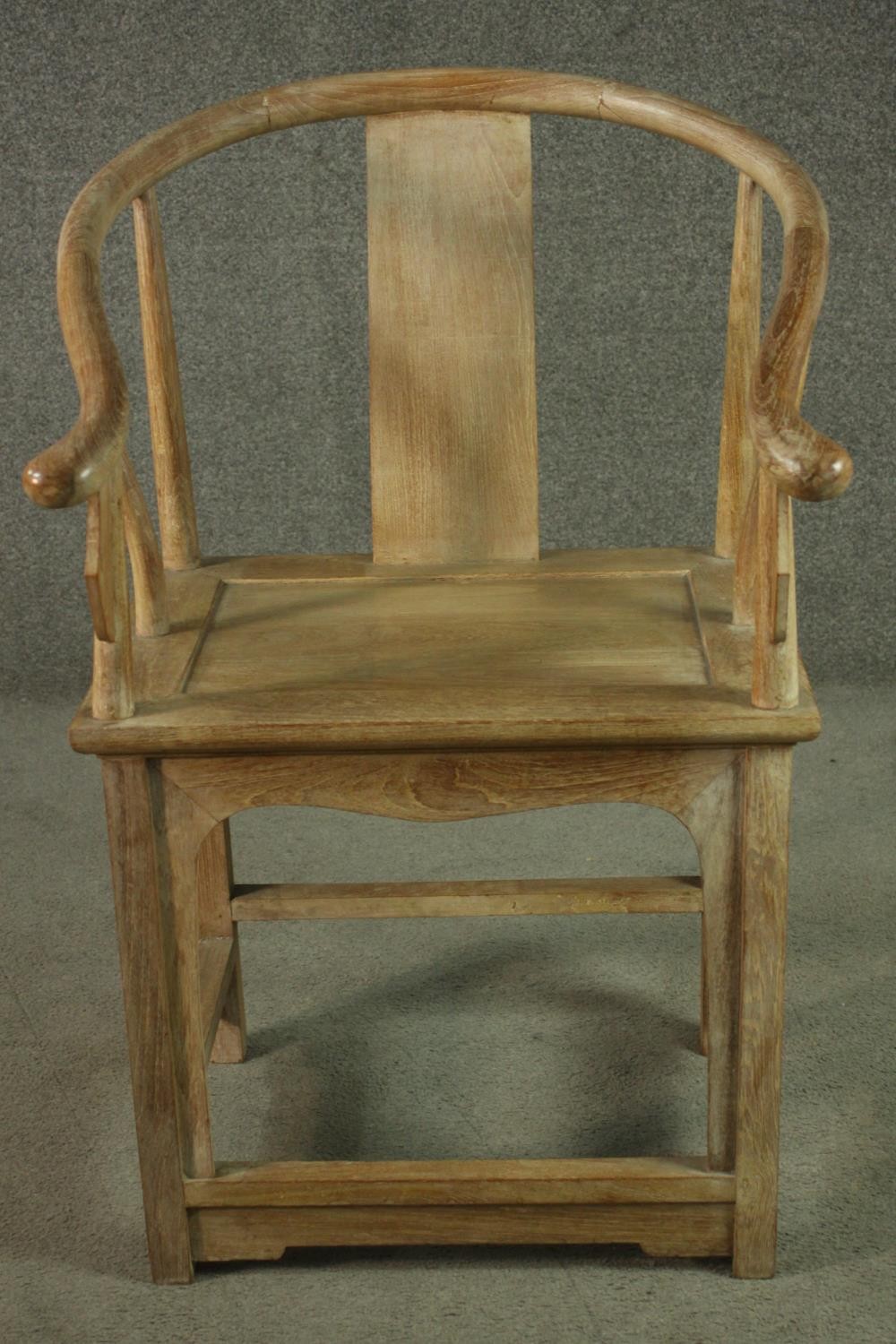 A pair of Chinese teak horseshoe back armchairs, with a plain splat back, the legs joined by - Image 9 of 17