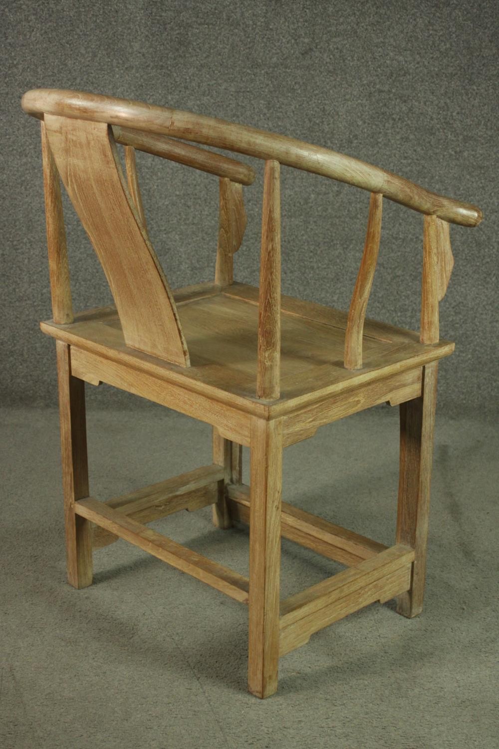 A pair of Chinese teak horseshoe back armchairs, with a plain splat back, the legs joined by - Image 13 of 17