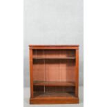 A Victorian walnut open bookcase, with adjustable shelving, on a plinth base. H.103 W.86 D.27cm
