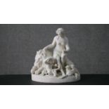 A large 19th century Parianware figure group of a classical female, lion, cherub and sheep. (Heavily