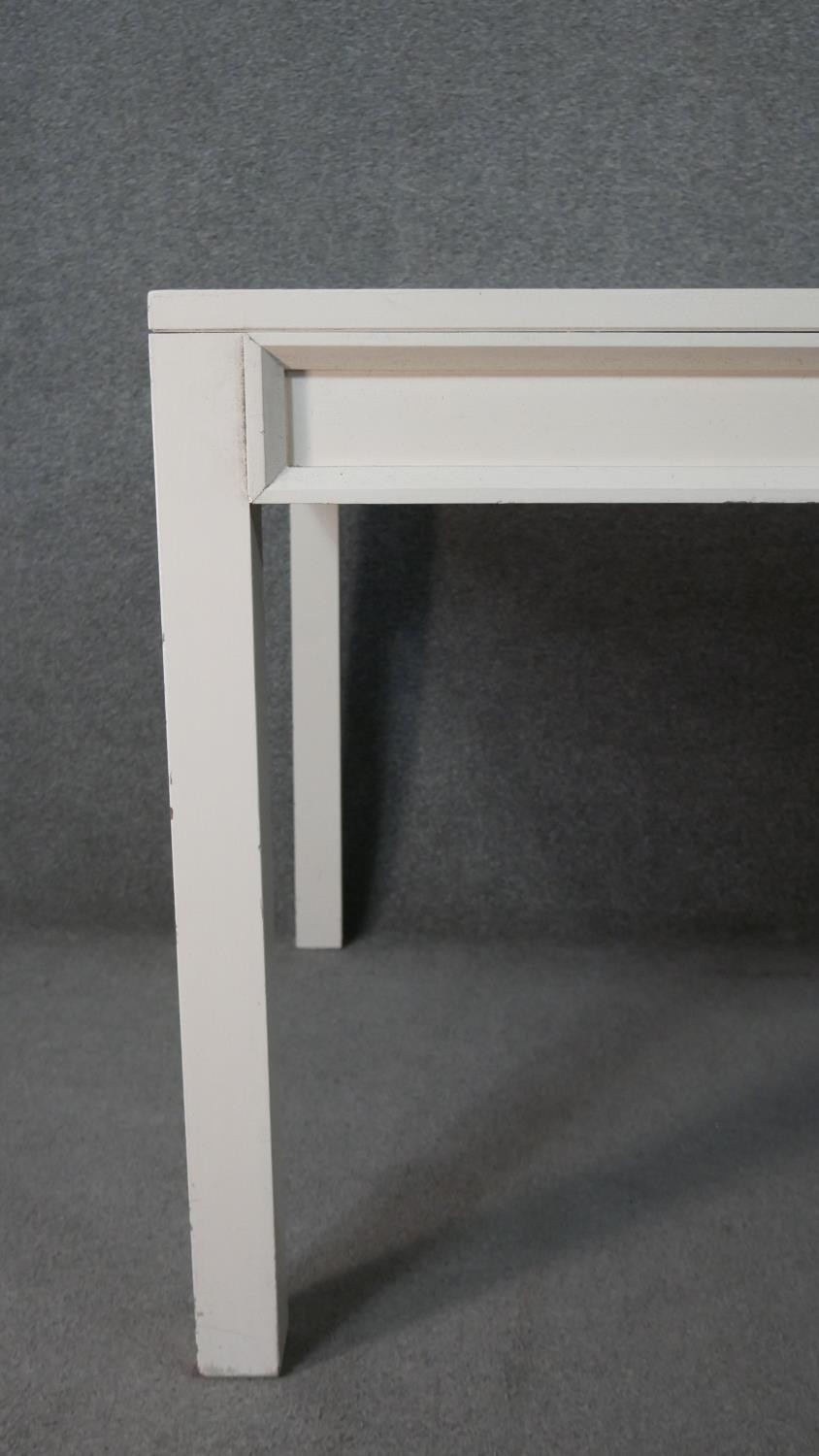 A contemporary white painted wood dining table, of rectangular form, on square section legs. H.75 - Image 3 of 4
