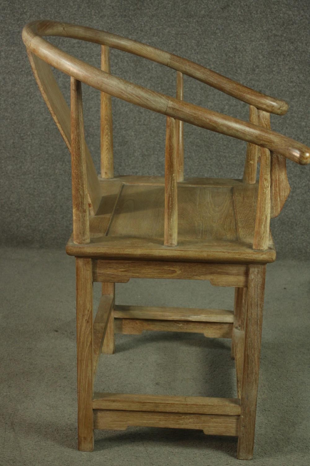 A pair of Chinese teak horseshoe back armchairs, with a plain splat back, the legs joined by - Image 11 of 17