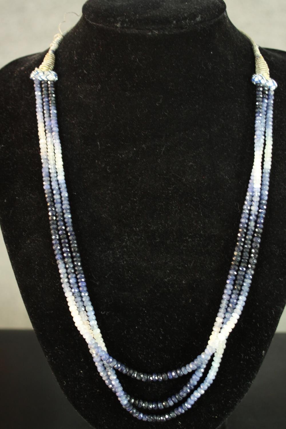 A boxed group of necklaces, including: a sapphire and white sapphire facetted bead necklace, an - Image 11 of 11