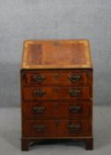 An 18th century style figured walnut bureau, of narrow proportions, with a crossbanded fall front