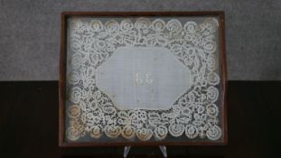 An oak and lace serving tray with embroidered monogram to the centre. H.5 W.43 D.34cm