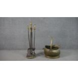 A Victorian brass and cast iron fire set along with a brass coal bucket with swing handle. H.75cm (