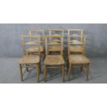 A set of six 19th century rustic pine kitchen chairs, with ladder back, over an elm seat, the legs