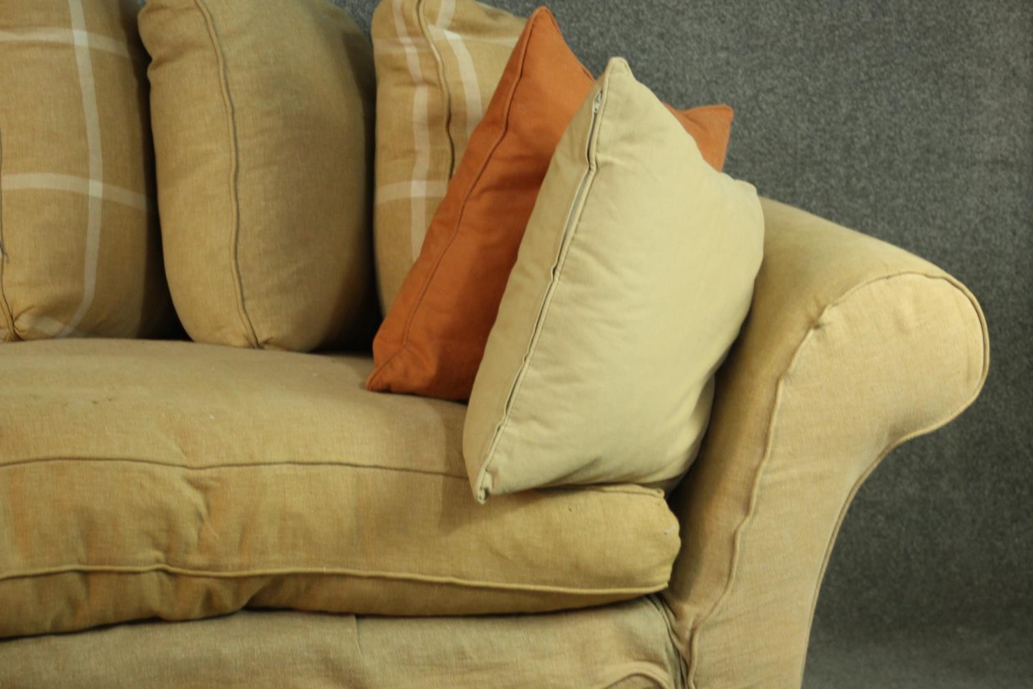 A contemporary three seater sofa, upholstered in ochre fabric, with scrolling arms and a selection - Image 3 of 8