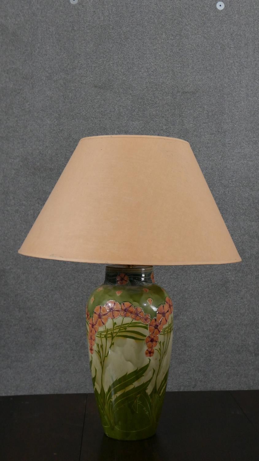 A pair of Minton Secessionist lamps with tube line stylised floral design on a green ground. Green - Image 2 of 8