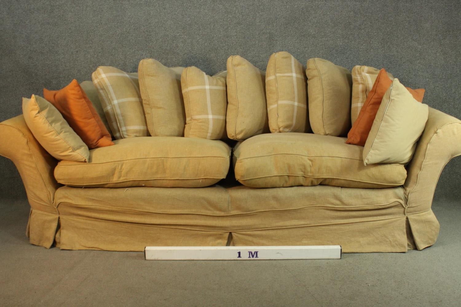 A contemporary three seater sofa, upholstered in ochre fabric, with scrolling arms and a selection - Image 5 of 8