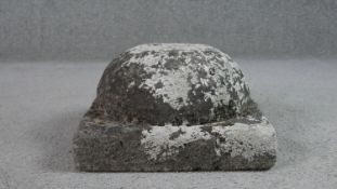 A weathered granite umbrella stand, the domed body on a square base. H.18 W.34 D.34cm