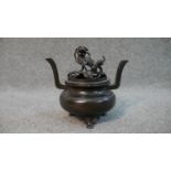 A bronze Chinese lidded censer with Buddhistic lion finial. H.13 W.14cm