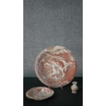 A large early 20th century marbled clay and terracotta serving bowl along with a matching smaller