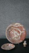 A large early 20th century marbled clay and terracotta serving bowl along with a matching smaller