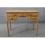 A Victorian pine kneehole desk, with an arrangement of four drawers with knob handles, on