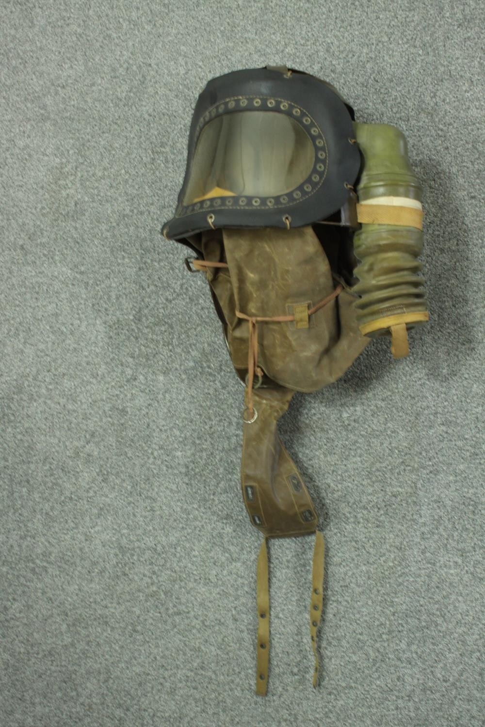 A WWII childs respirator with military issue gas mask and WWII helmet, stamped FG. H47 W.40cm. ( - Image 3 of 9