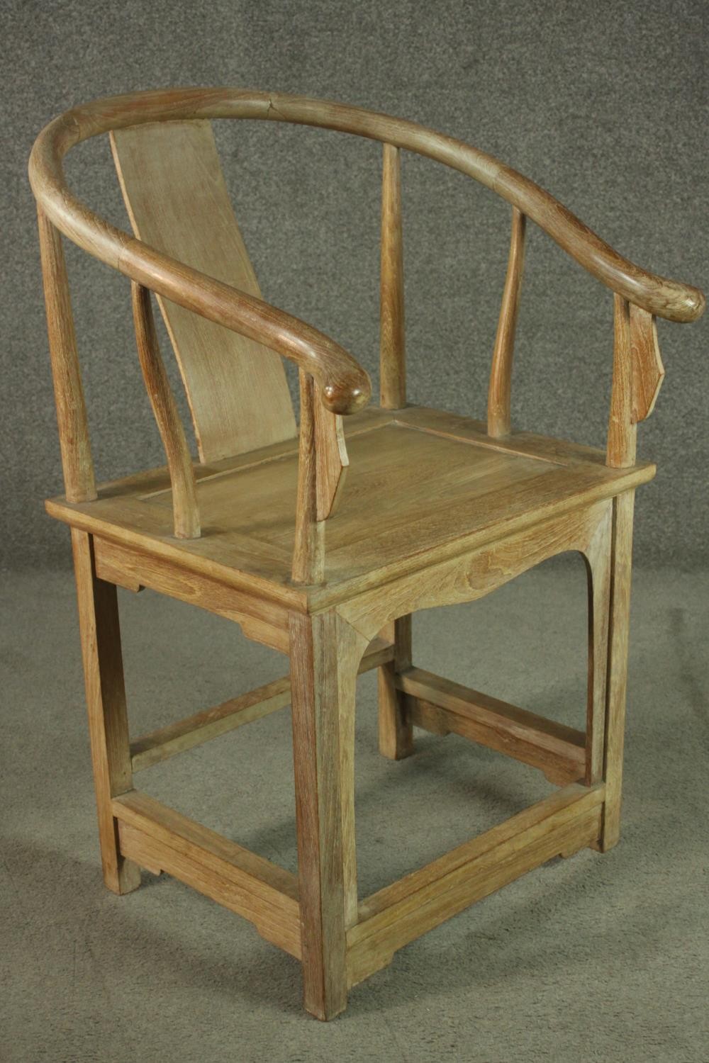 A pair of Chinese teak horseshoe back armchairs, with a plain splat back, the legs joined by - Image 10 of 17