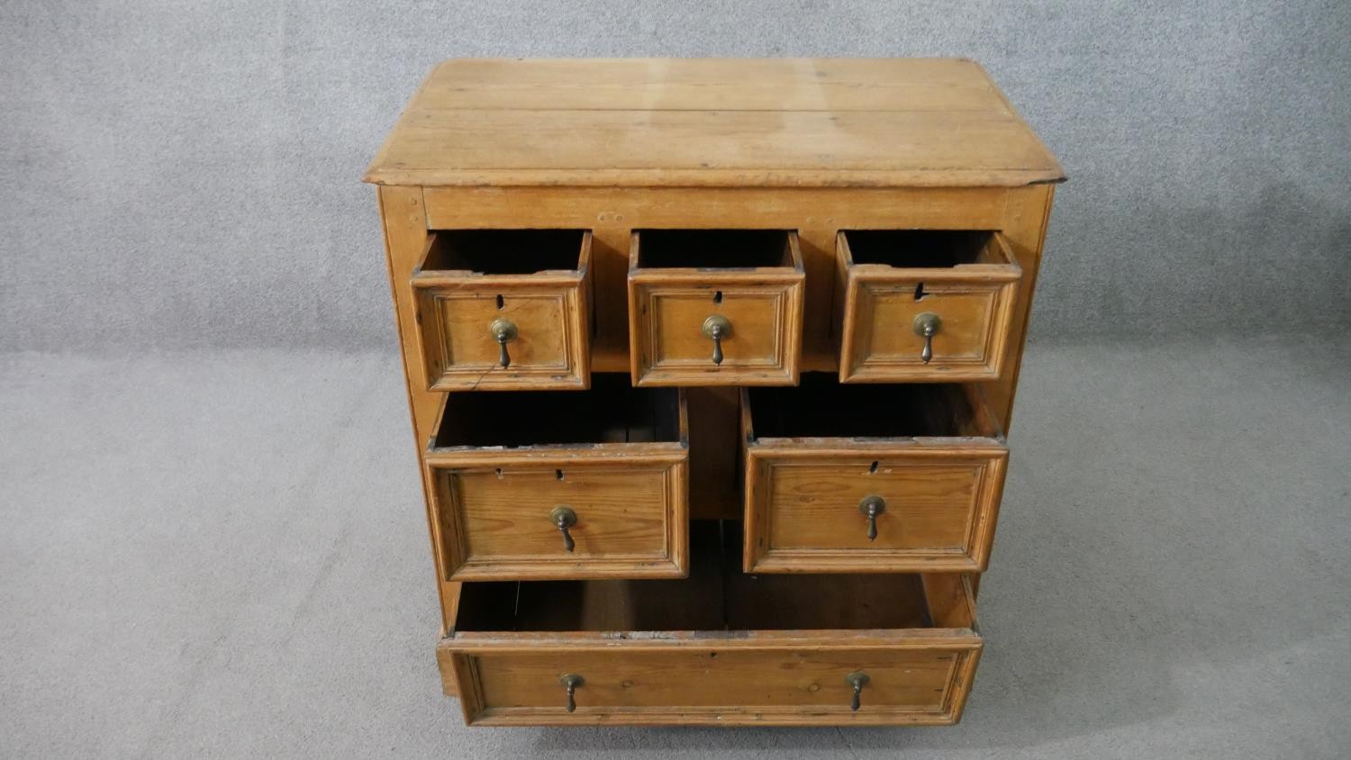 An 18th century pine chest, with a plank top above three short, over two short, over one long - Image 4 of 8