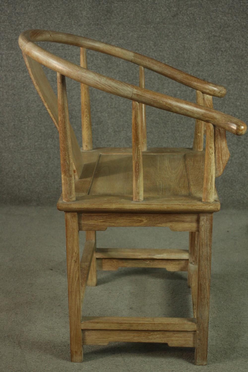 A pair of Chinese teak horseshoe back armchairs, with a plain splat back, the legs joined by - Image 12 of 17