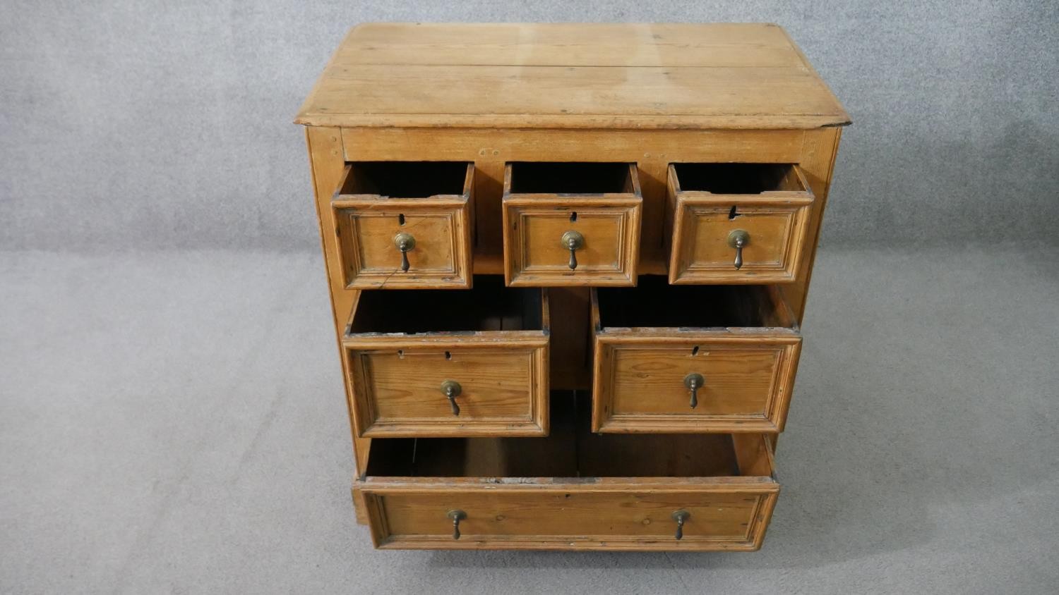 An 18th century pine chest, with a plank top above three short, over two short, over one long - Image 3 of 8