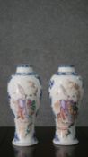 A pair of Qianlong 18th century Chinese hand painted vases with figural design and blue and white