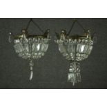 A pair of small basket form chandeliers, with brass mounts, hung with lustres. H.45 Dia. 23cm.