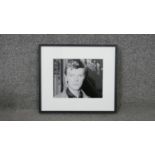 A framed black and white photograph portrait of David Bowie, with Brider & Bull label verso. H.32