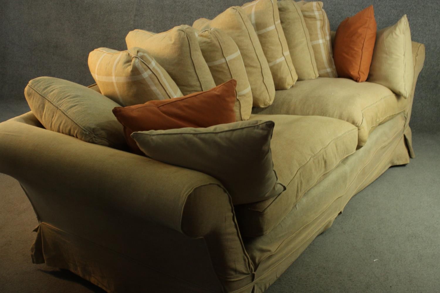 A contemporary three seater sofa, upholstered in ochre fabric, with scrolling arms and a selection - Image 8 of 8