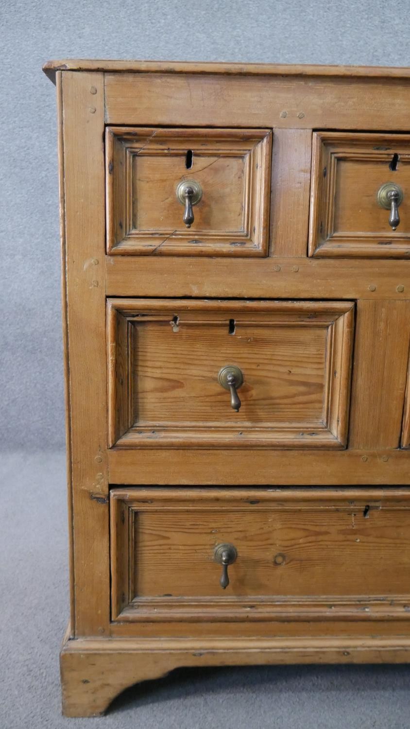 An 18th century pine chest, with a plank top above three short, over two short, over one long - Image 6 of 8