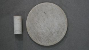 A large carved limestone serving board with matching roller. Diam.60cm