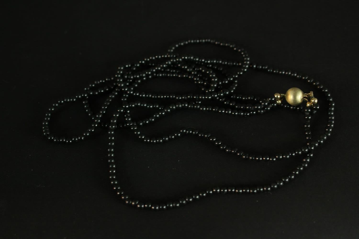 A boxed group of necklaces, including: a sapphire and white sapphire facetted bead necklace, an - Image 5 of 11