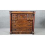 A William IV flame mahogany Scottish chest, with a cushion drawer over a hat drawer, flanked by