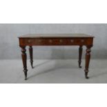 A William IV mahogany library table, with a tooled green leather skiver, over three short drawers,