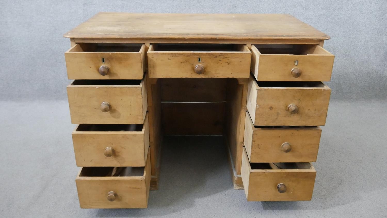 A Victorian pine kneehole desk, the rectangular top with a moulded edge, over an arrangement of nine - Image 3 of 6