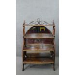 A late 19th/early 20th century Thonet style waterfall bookcase, the bentwood scrolling gallery