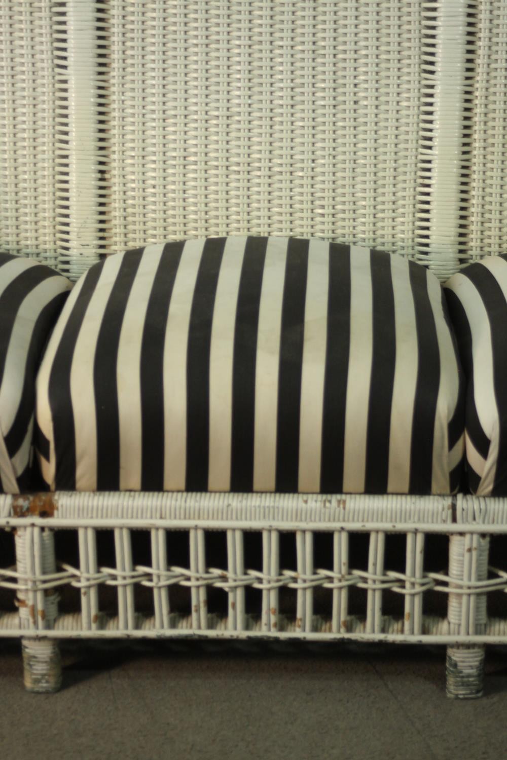 A white painted rattan garden three seater sofa, of woven construction, with a black and white - Image 9 of 9