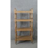 A Victorian pine whatnot, with four shelves joned by baluster turned stems. H.125 W.59 D.38cm